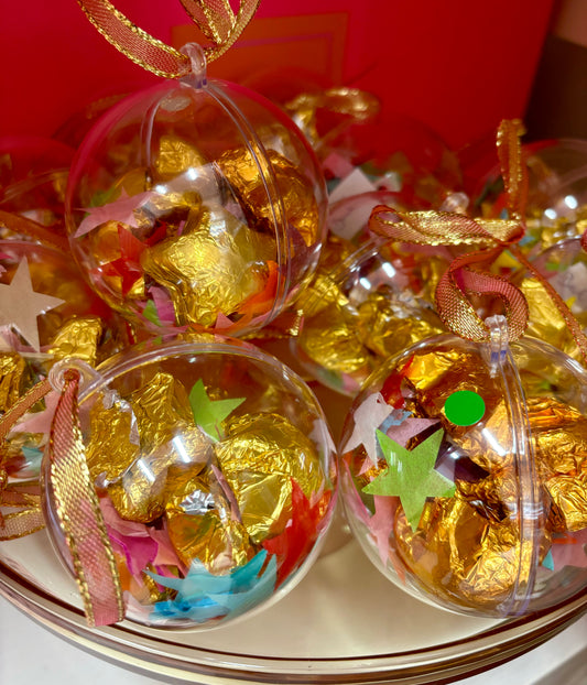 A Chocolate Bauble filled with 5 Gold Stars